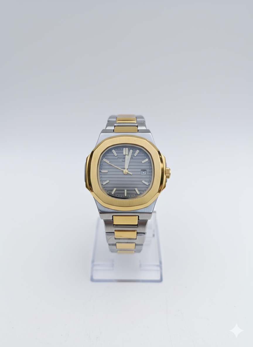 Two-tone watch with silver and gold band on a clear stand against a white background