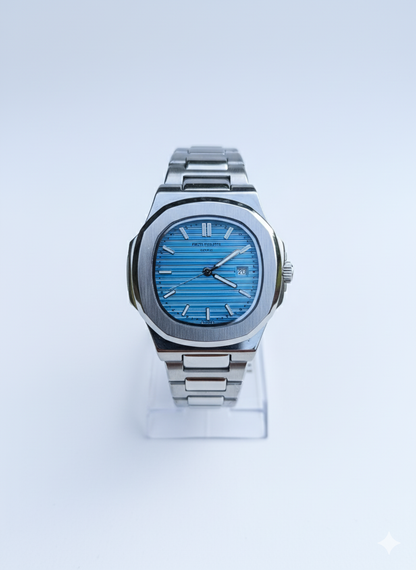 Silver watch with a blue face on a white background